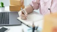 Images shows, a desk and a laptop