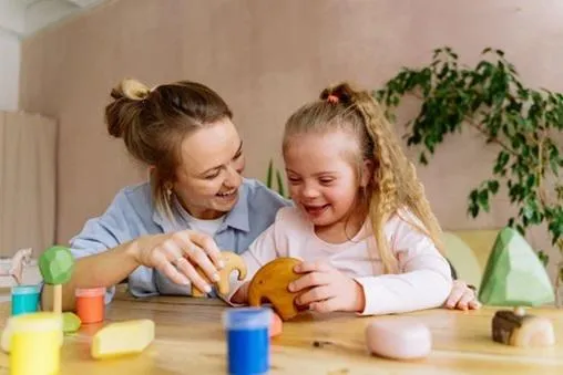 Mum and daughter playing with wooden toys
