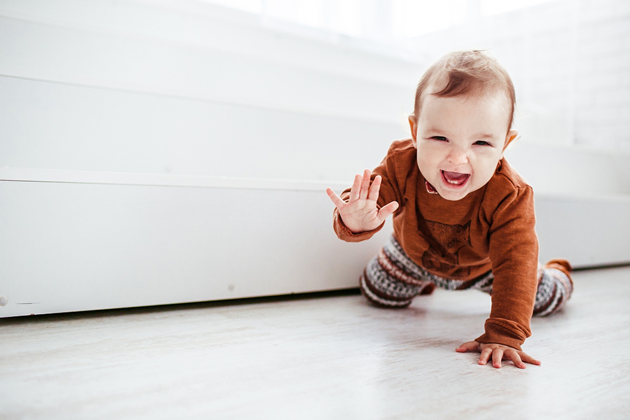Baby crawling and smiling