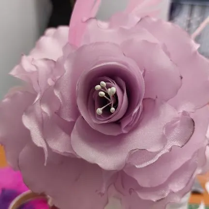 Fabric rose bud. Done in our Millinery Workshop