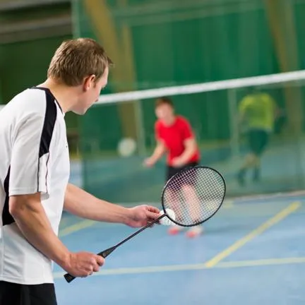 Man playing badminton