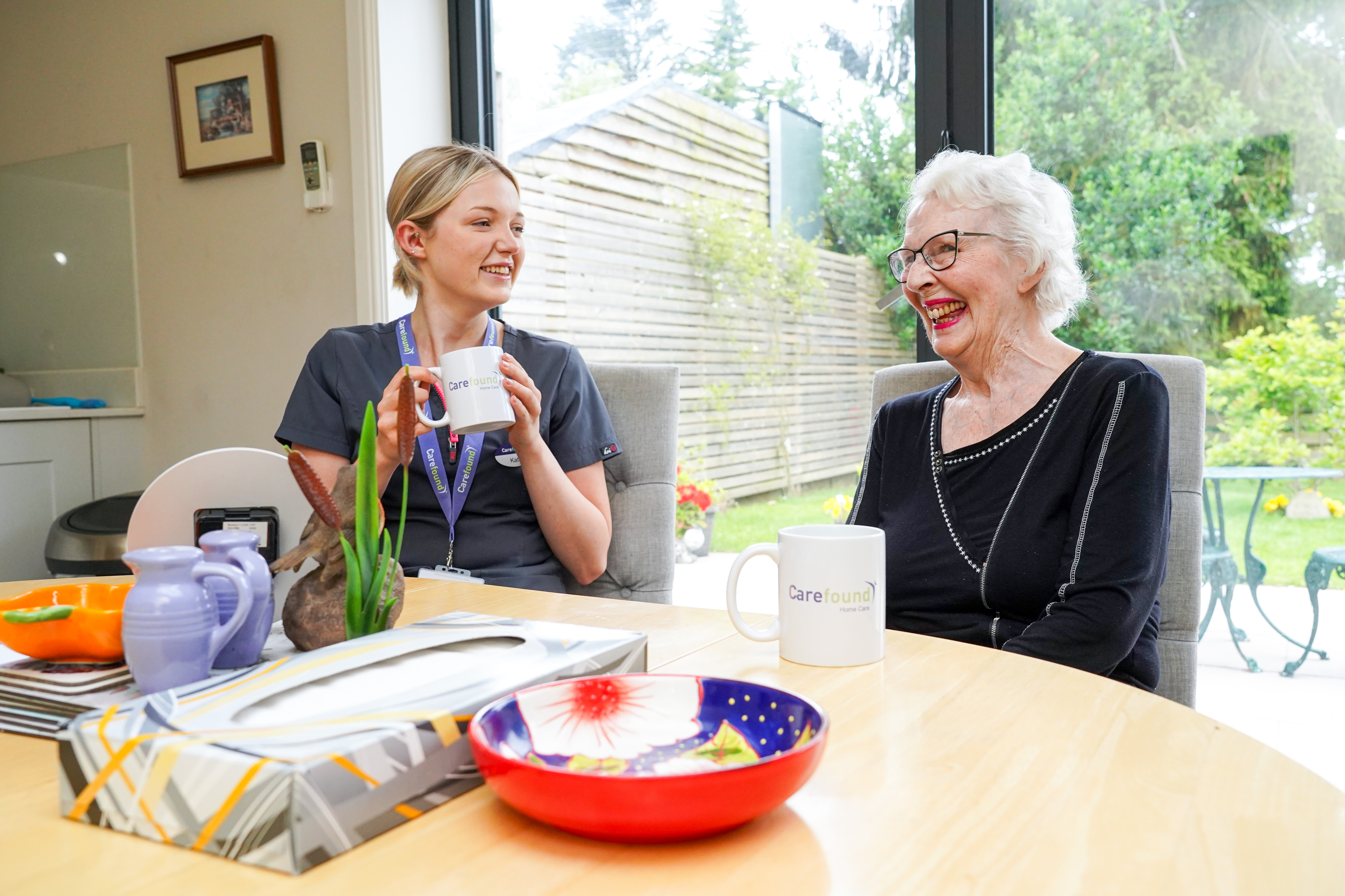 Carer chatting with elderly lady