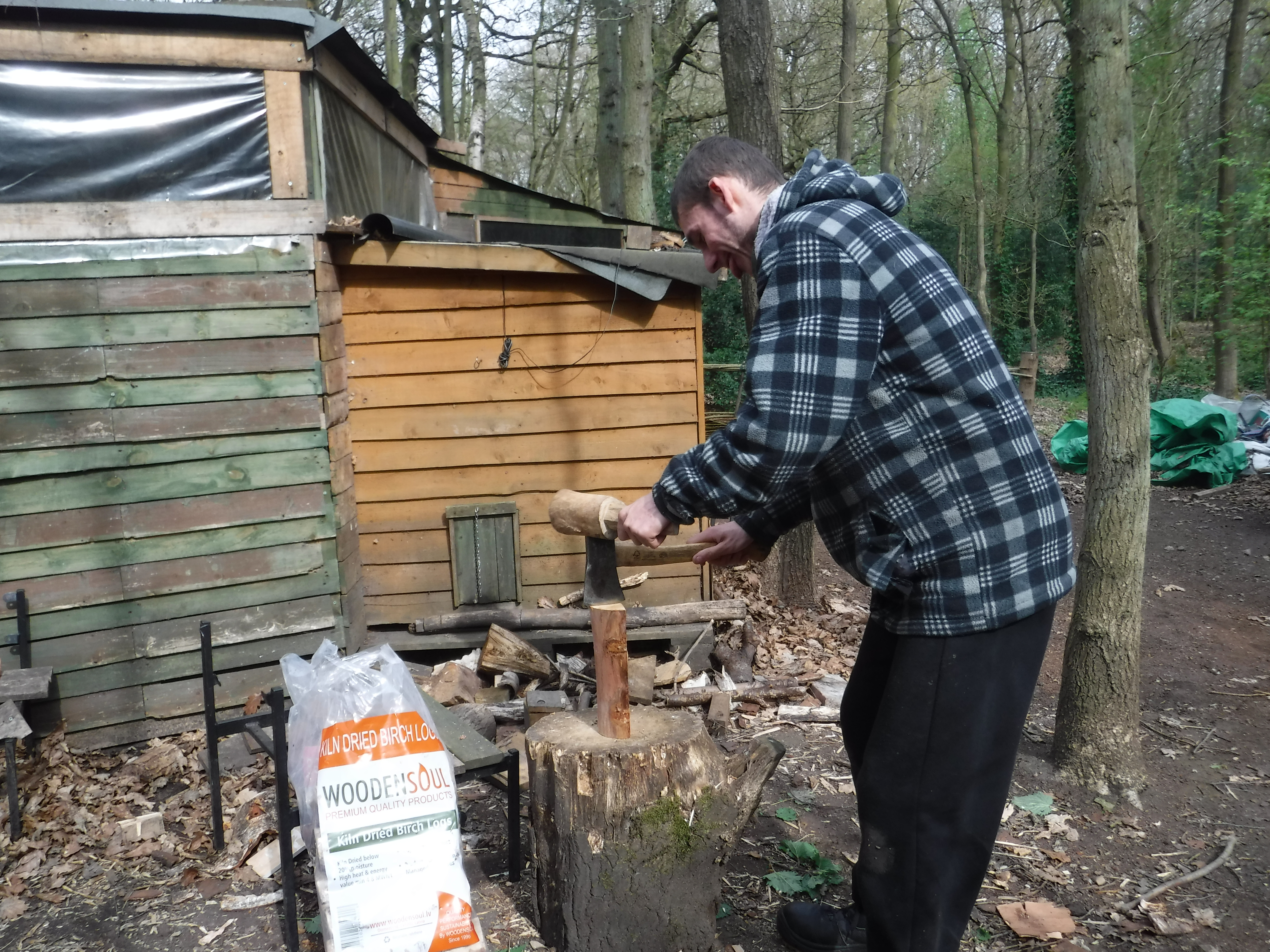 Man chopping wood with a small axe