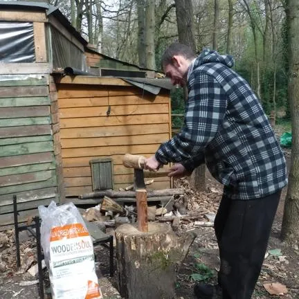 Man chopping wood with a small axe