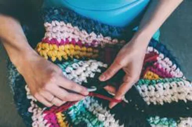 person crocheting