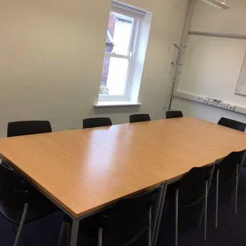 Meeting Room - Upstairs
large wooden table with surrounding chairs
large wooden table with surrounding chairs