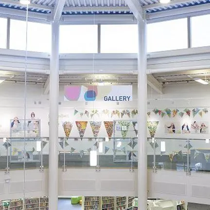 Inside of Worksop Library - large room with lots of windows and natural light.