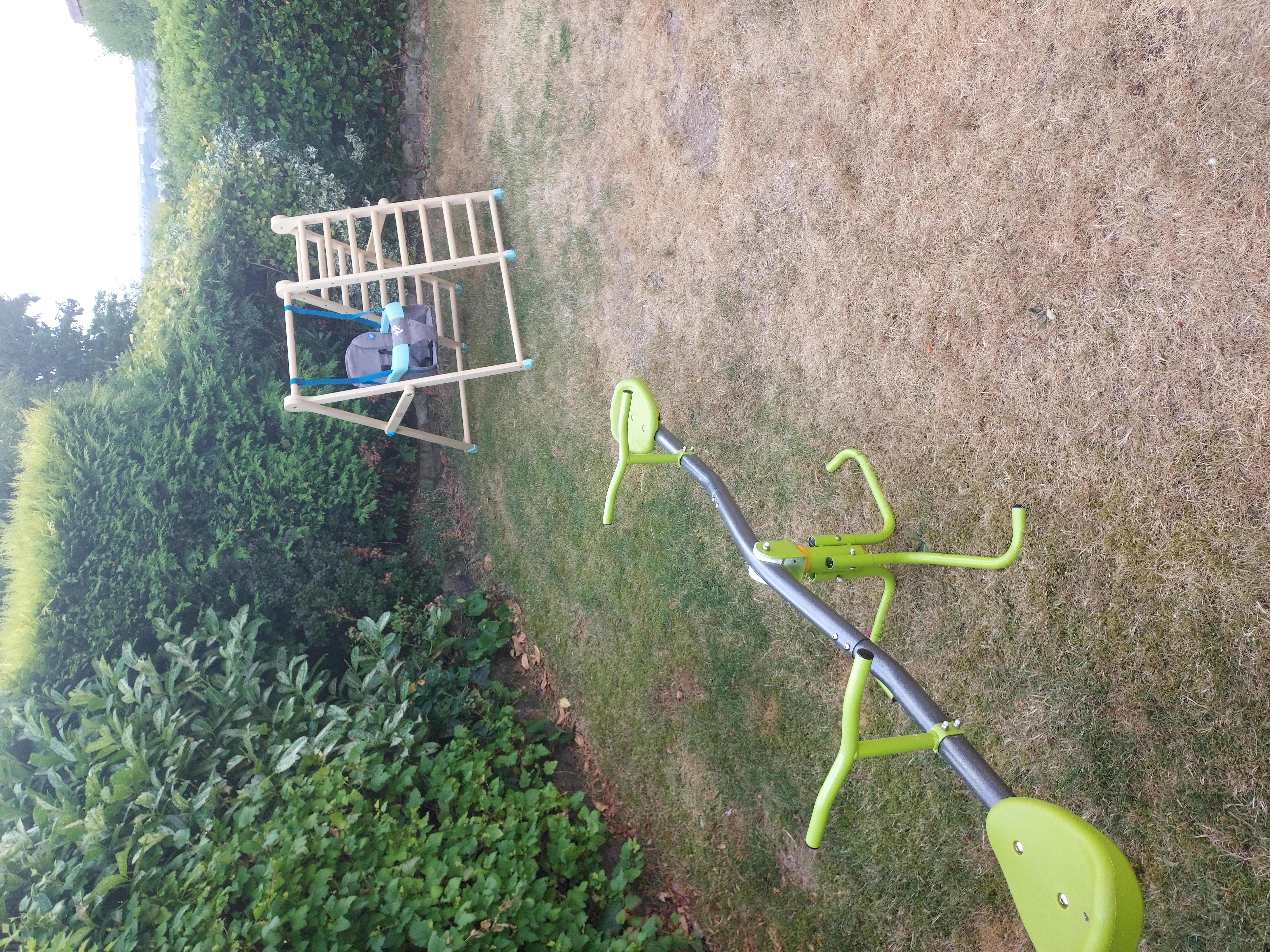 Garden with a seesaw and a swing set